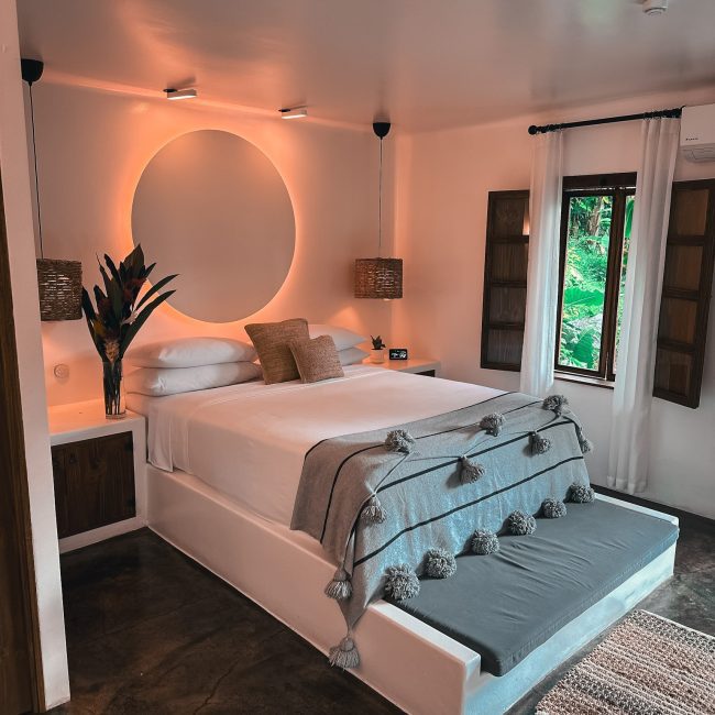 a boutique bedroom with a bed at beautiful boutique hotel Vayu Retreat Villas in Costa Rica
