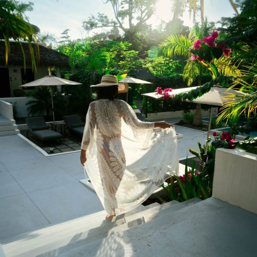 Woman walking through a beautiful boutique hotel in Uvita Costa Rica