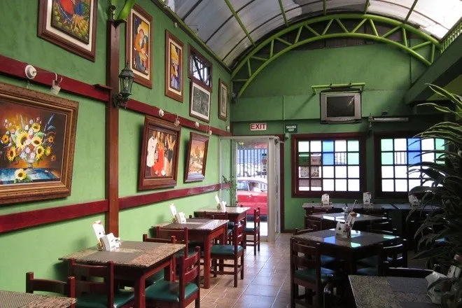 Visiting San José, Costa Rica: The cozy and colorful interior of Restaurante La Criollita, a local favorite for authentic Costa Rican cuisine.